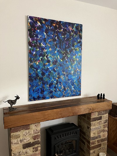 Cornflowers painting hanging over clients mantle