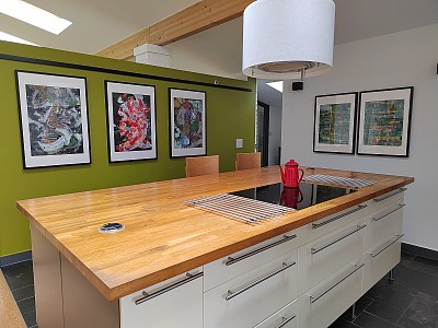 Abstract paintings hanging in a kitchen