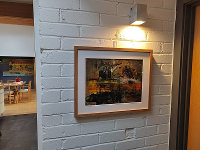 Abstract painting on a brick wall showing scale