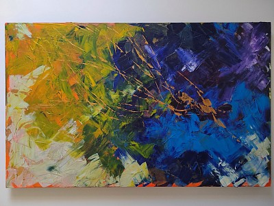 Abstract of yellow and green merging to blue and purple with a diving figure